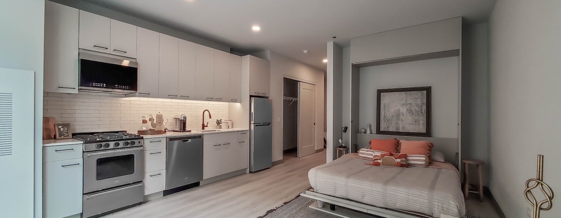 a large kitchen with a bed