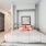 a bedroom with a bed and a kitchen