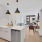 a kitchen with a table and chairs