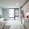 a kitchen with a bed and a television