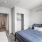 a bedroom with a bed and a door