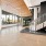 a clubhouse entrance area with stairs and wood floors