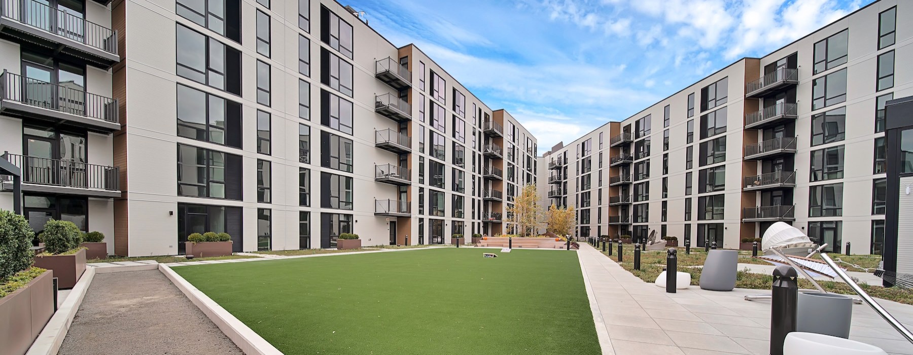 a courtyard with a building in the background