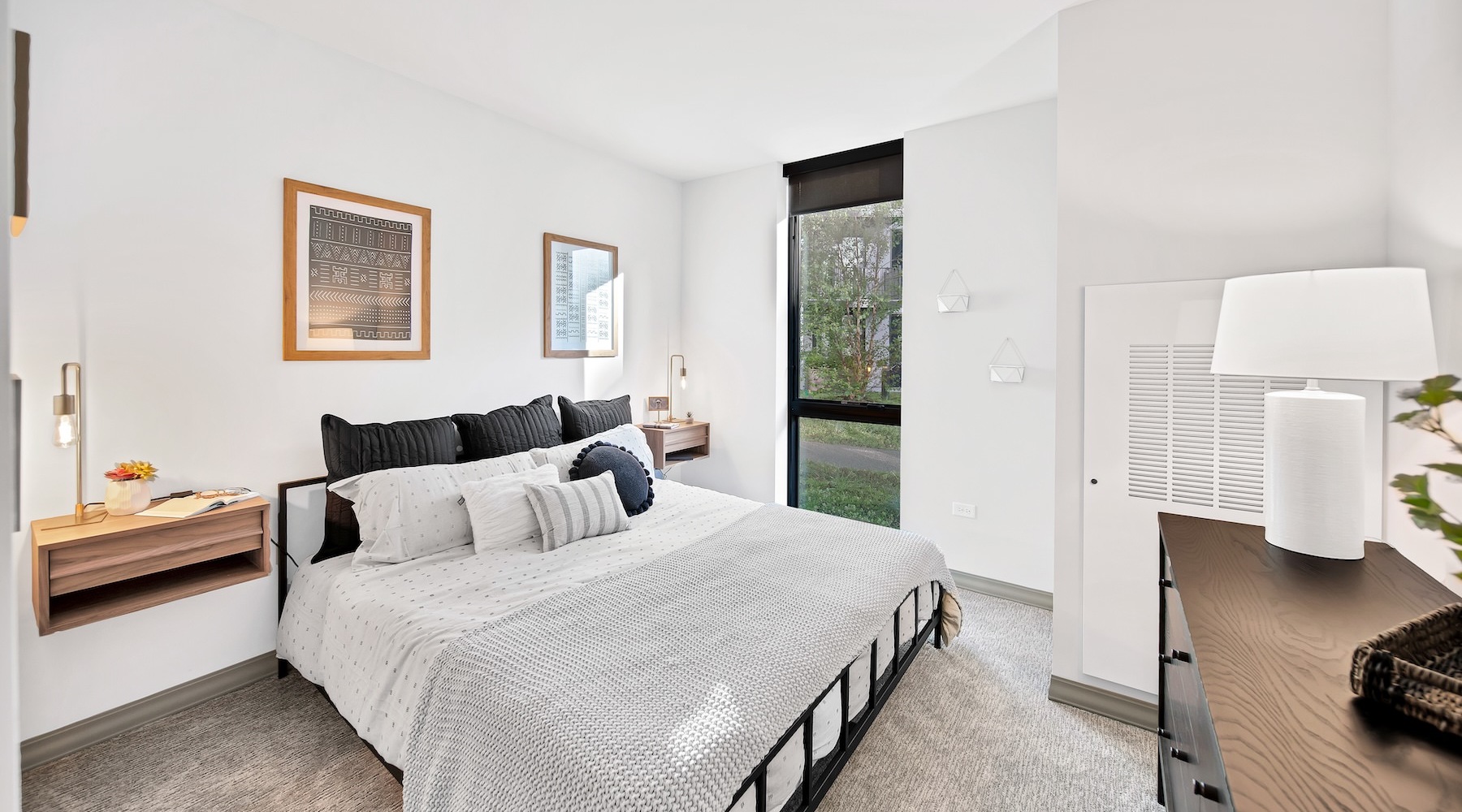 a bedroom with a bed and two nightstands