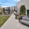 a courtyard are with a couch and tables