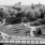 a large park area with a bridge