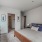 a bedroom with a bed and a lamp