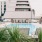 a pool with a building in the background