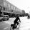 a person riding a bicycle down a street